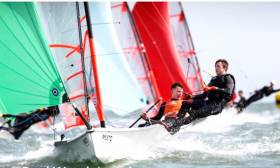 Royal Cork&#039;s Harry Durcan and Harry Whitaker with green spinnaker in a downwind leg at the 29er British Youth Nationals