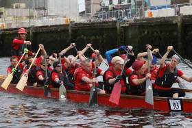 Member of Frankfurt Canoe Club FKV in a Dragon Boat  the Ocean to City Race, An Rás Mór as part of Cork Harbour festival at the finish line  Cork City Centre