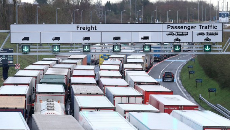 Some Irish truckers stranded in UK will have to look at other routes, says Eamon Ryan. Above file photo dated Dec. 11th of lorries queuing to access the Eurotunnel site near Folkestone in Kent. AFLOAT adds at nearby Port of Dover is closed to all accompanied traffic leaving the UK until further notice. Operation Stack (phase 2) has now been implemented to deal with freight trucks.