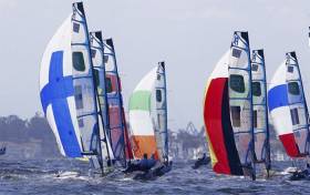 The tricolour spinnaker of Ryan Seaton and Matt McGovern is clearly visible at the front of Rio&#039;s 49er fleet. The Northern Ireland pair won race four today to lie second overall after four races sailed