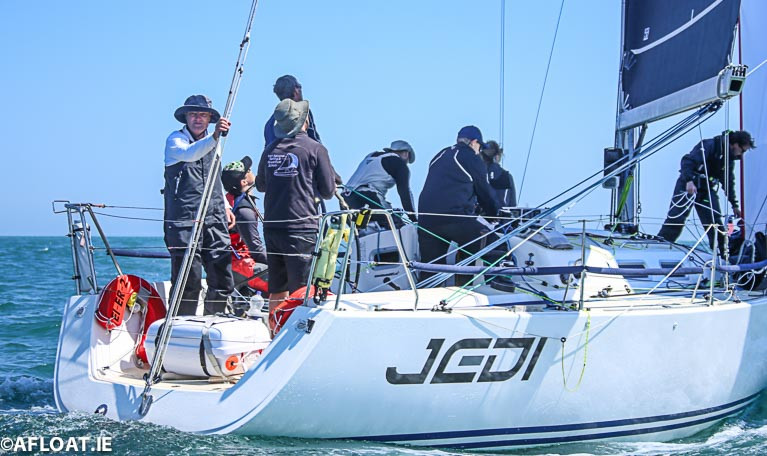 Michael Boyd (facing aft) onboard Jedi at the start of the 2018 race is the lead skipper for the Round Ireland Volvo Car prize