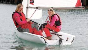 People at every level can get involved with bringing newcomers into the sport. Showing how it’s done with a Toppper Topaz at a Try Sailing Women on Water event is former Olympian Cathy MacAleavey (left) with sailing newbie Sarah Byrne 
