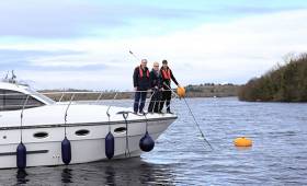 Manor Marine tourists with a WI Director and the new mooring buoys on Lough Erne