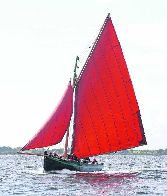 With her staysail stowed as she approaches the pier in Kinvara, the Croi an Cladaig is a handsome 2012 example of the traditional boats being built by Badoiri na Gaillimh in the heart of Galway City