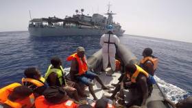 Rescued migrant refugees on board a RHIB belonging to the OPV LÉ William Butler Yeats as seen off Libya