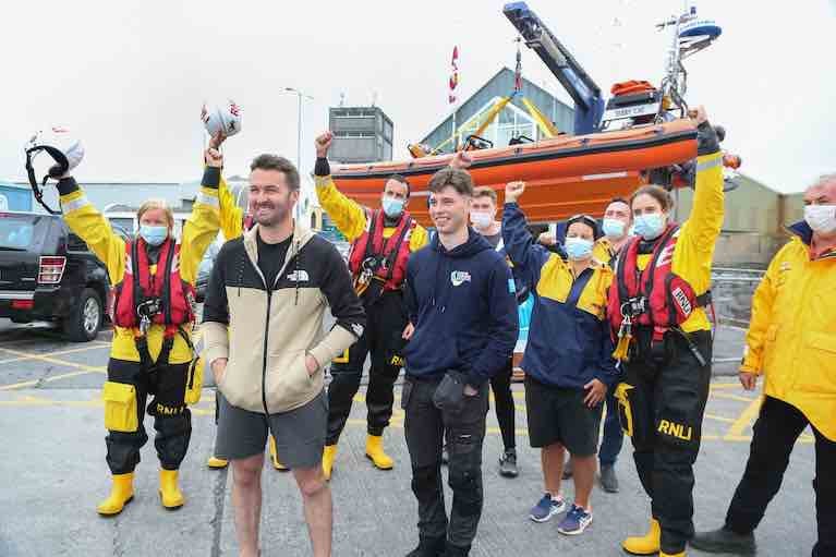 Patrick Oliver and his son Morgan, who rescued cousins Ellen Glynn and Sara Feeney off Inis Oirr island, with some of Patrick’s RNLI colleagues on their arrival back at the Galway RNLI Lifeboat Station at Galway Docks