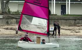 New Zealand boat builder Matthew Mason has developed a clip-on bow and a new rig for the Optimist dinghy which can be handled by two lighter kids or one heavier kid