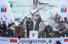 Peter Burling and crew raise the Auld Mug aloft after their victory in the 35th America’s Cup in Bermuda on Monday 26 June