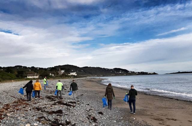A team from TD securities on Killiney Beach, Co. Dublin which recently participated in a great beach clean-up group as part of a Clean Coasts programme 