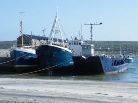 Berthed at Kilronan Pier on Inis Mór is the Chateau-Thierry (first from right), a former US Army landing craft vessel that recently transported electrical generators to the neighbouring islands