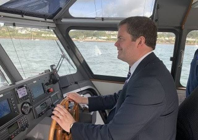 Political Pilot: At the helm of a Port of Milford Haven pilot cutter is the UK's Parliamentary Under-Secretary of State for Wales Kevin Foster during a recent visit of the UK's largest energy port located in the Principality on the Pembrokeshire coast. Among topics discussed was the potential opportunity, post-Brexit, for the Welsh port to be designated as a Freeport.