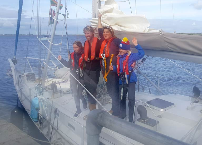 Vera and Peter Quinlan-Owens with Lilian and Ruairí on board Danú of Galway after berthing at Parkmore pier, near Kinvara, Co Galway yesterday after 14 months at sea