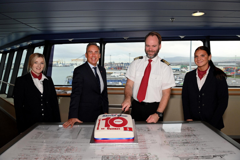Decade at Cairnryan; Stena Line Superfast VIII OSS crew Caitlan Nicholl (left) Morgan Cowan (right) joined Paul Grant (Trade Director) and Senior Master Steve Millar on board the Bridge of Superfast VIII to mark (today’s Sun. 21 Nov) the 10th anniversary of Stena Line’s relocation of Scottish port, from Stranrear to nearby Cairnryan Port back in 2011.  Since then, the North Channel route has enjoyed a number of notable milestones including transporting over 11.1m passengers, 2.6m cars, 1.9m freight units during 40,747 sailings.