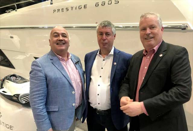 MGM Boats John O'Kane (left) from Belfast Lough with Martin (centre) and Gerry Salmon of MGM Boats in Dublin on board the boot Dusseldorf 2018 Prestige stand with the new 70-foot Prestige 680s