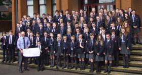 Larne Grammar School year 8 pupils with their cheque for well over £1,000 to the Larne lifeboat