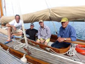 Serial classics restorer Rob Mason (right) aboard the successful Myfanwy in Dun Laoghaire with shipmates (left to right) Max Mason, Gus Stothert, and Andy Whitcher. Photo: W M Nixon