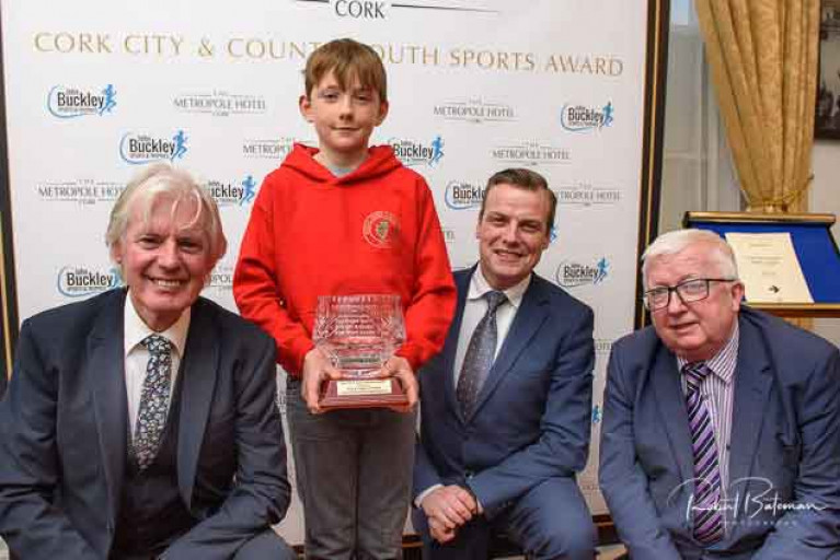 Nine-year-old Olin Bateman collects his award from the judges