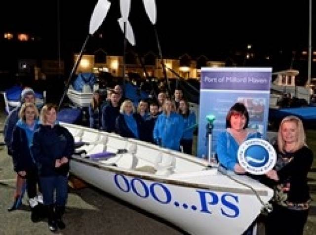 Anna Malloy, PR & Communications Manager at the Port of Milford Haven, with Pembrokeshire Yacht Club members