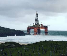 The drilling rig Transocean Winter leans on the beach at Dalmore on Lewis after blowing ashore in high winds