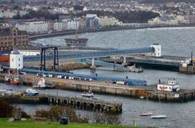 A close up view of Douglas Harbour&#039;s ferry terminal and visible (on the left), one of two ro-ro ramp linkspans and associated covered passenger walkways.  