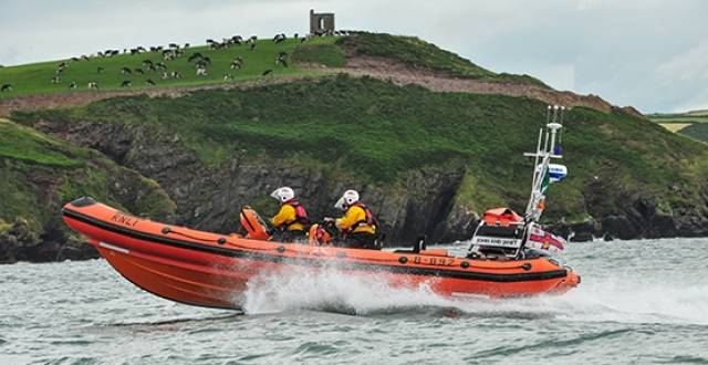 Crosshaven RNLI Inshore lifeboat speeds past Roches Point at the entrance to Cork Harbour