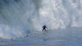 Andrew Cotton rides the big swell at Nazaré in Portugal in 2014
