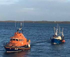 Donaghadee all-weather lifeboat Saxon towing rescued fishing vessel