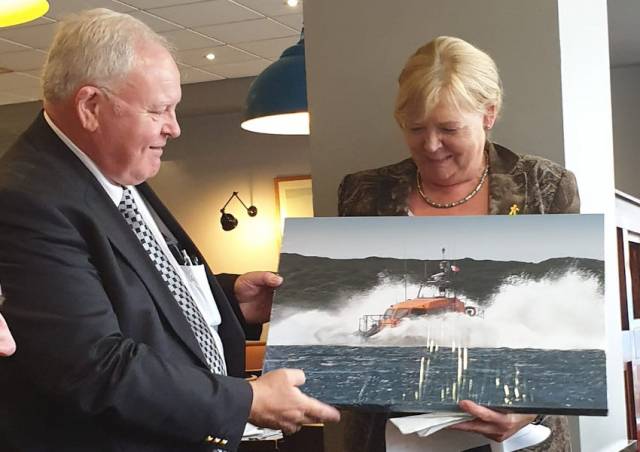 Tony Hiney (left) is presented with a canvas photograph of Clifden’s new Shannon lifeboat