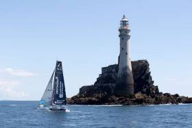 Tom Laperche, skipper of the Figaro yacht Bretagne passes the Fastnet Rock on his way to the Kinsale finish