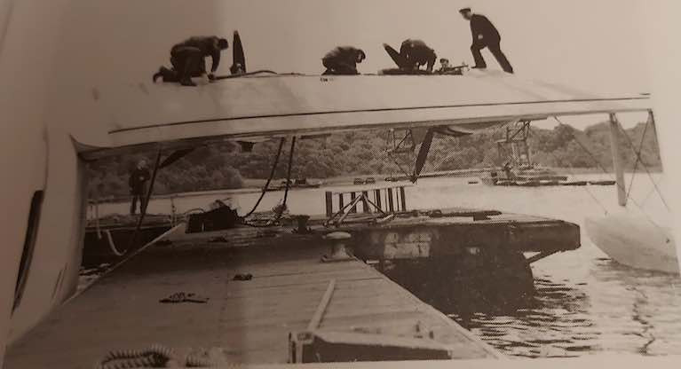 Working on the wing of a seaplane on Lough Erne