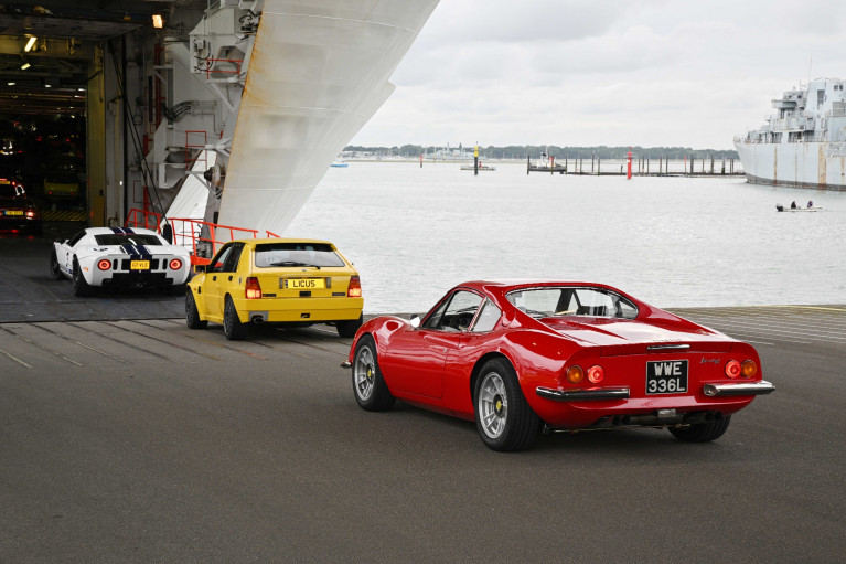 Some of the 400 classic cars seen boarding Brittany Ferries in Portsmouth to take the ferry to Caen, Normandy, from where last week the beautiful vehicles headed for the Le Mans Classic Festival. Afloat adds on right is the moored former 1970's Royal Navy destroyer HMS Bristol which became a Harbour Training Ship in the Hampshire port until decommissioned in 2020