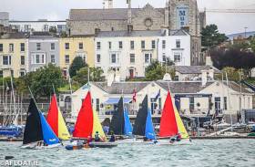 Firefly dinghy racing in front of the National Yacht Club. The Dun Laoghaire Harbour club will celebrates its 150th birthday next June with a special regatta