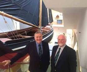 Jack Roy and Pierce Purcell enjoying the ambience of the maritime section in Galway Museum, where this full-size traditionally-rigged gleoteoig is suspended from the ceiling to make for a striking centrepiece in an exhibition which celebrates Galway’s exceptionally long links with seafaring