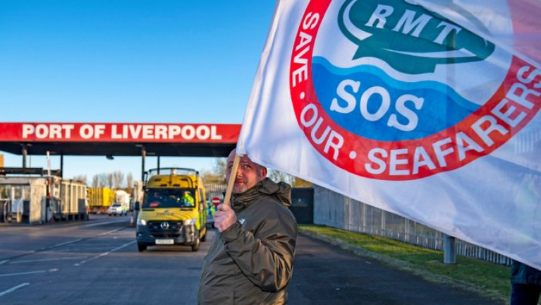 Department of Transport considering British measures in response to P&amp;O mass sacking. Above a protestor takes part in a demonstration against the dismissal of P&amp;O workers at the Port of Liverpool from where Afloat adds the operator has a route to Dublin Port, albeit not working to full capacity as one ferry, Norbay remains tied up at the Merseyside port. 