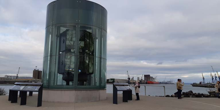 The Great Light is a curved glass interpretive structure designed to resemble a lighthouse lantern room