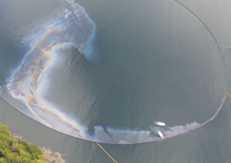 A still from aerial footage of the oil leak at the wreck of the Belfast-built MV Schiedyk at Bligh Island, British Columbia