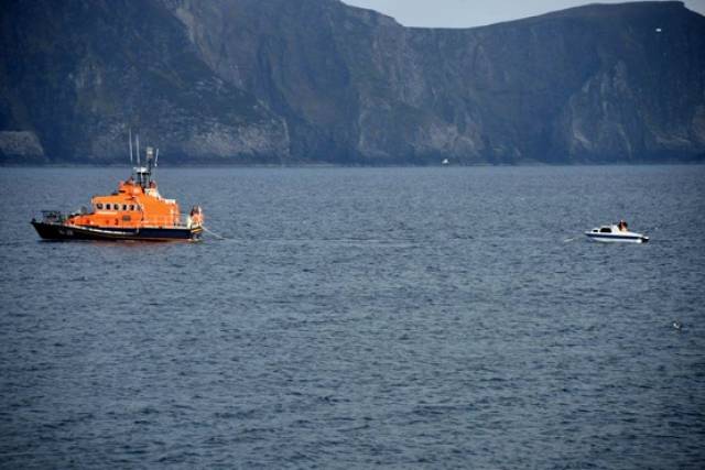 Achill's all-weather lifeboat Sam and Ada Moody tows a stricken cabin boat Purteen Harbour