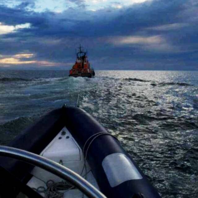Donaghadee RNLI's all-weather lifeboat Saxon tows a RIB to safety  from the North Channel