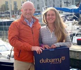Michael Walsh of Dubarry presented Belgian solo sailor Caroline Adriens with a very practical gift of the latest Dubarry Shamrock Boots in Galway before she departed south on her dream voyage