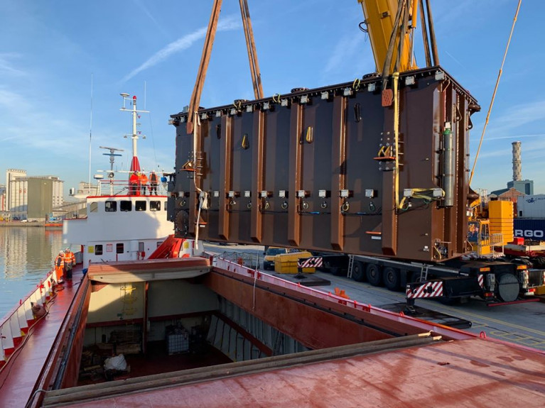 A 120 tonne transformer that was in the cargo hold of veteran vessel MV Saturn (1966/627grt) was discharged by Doyle Shipping Group (DSG).  The small red hulled ship is a survivor in this day of considerably increasing sized ships.  