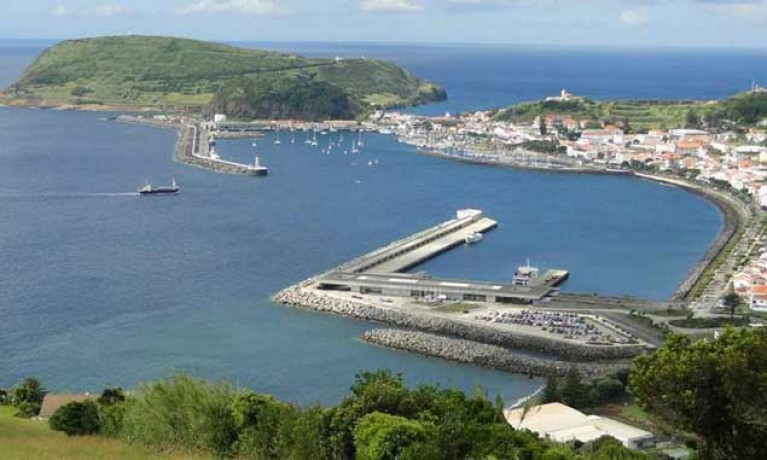Friendly port and ocean crossroads – Horta in the Azores, with the commercial, ferry and cruise-liner berths in foreground, while the anchorage, old harbour, and yacht harbour are beyond