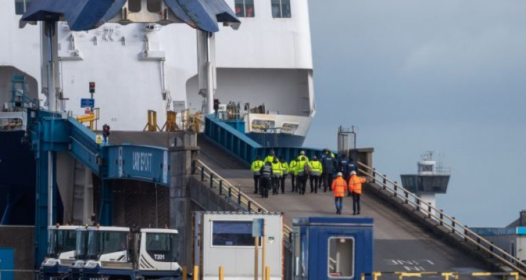 Security and severance personnel board P&O Ferries ropax European Causeway in Larne Port, Co Antrim. P&O have two routes from Ireland, Larne-Cairnryan and Dublin-Liverpool. Both services serving Scotland and England are suspended after P&O said it was ceasing operating temporarily which also includes their UK routes from Hull and Dover to mainland Europe. 