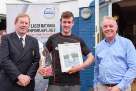 Overall winner in the Laser Standard Finn Lynch (centre) is presented with his prize by (left) John Roche Admiral Royal Cork and sponsors Mark Whitaker of Volvo. Scroll down for photo gallery of prizewinners